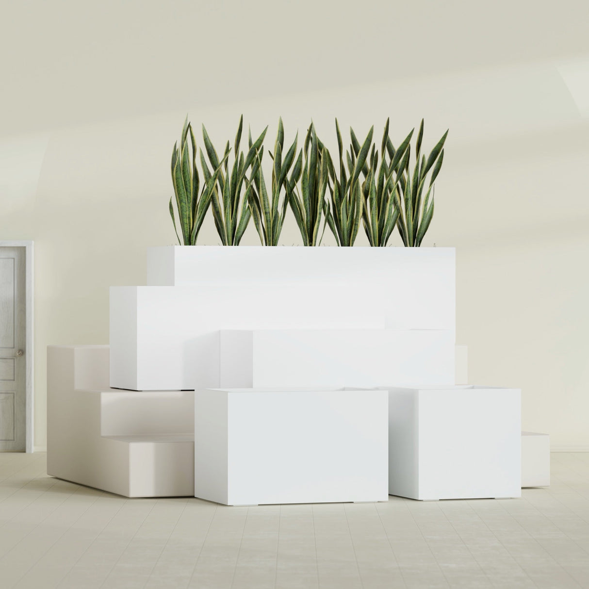 Granada fiberglass planter in Matte Bright White, size range, in a sunlit interior