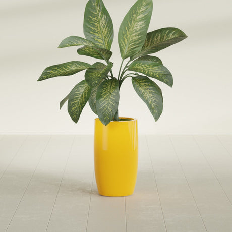 Lisbon Tall Round fiberglass planter in Gloss Saffron, shown planted, in a sunlit interior