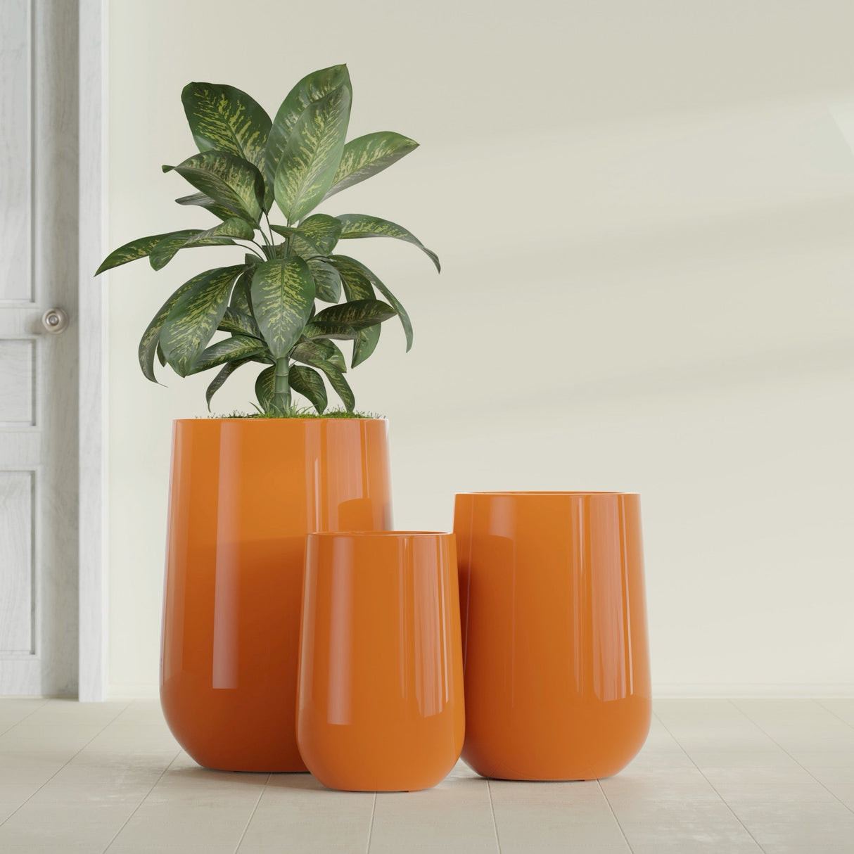 Hayden Urn fiberglass planter in Gloss Tangerine, size range, in a sunlit interior
