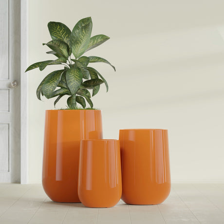 Hayden Urn fiberglass planter in Gloss Tangerine, size range, in a sunlit interior