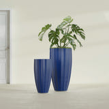San Jose Tall Fluted fiberglass planter in Matte Cobalt Blue, size range, in a sunlit interior