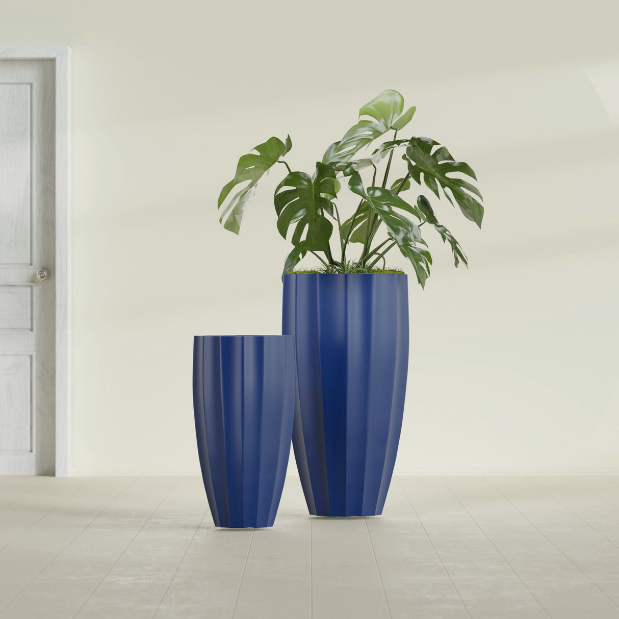 San Jose Tall Fluted fiberglass planter in Matte Cobalt Blue, size range, in a sunlit interior