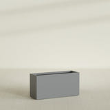 Tolga Rectangular Planter in Matte Gunmetal, 48"L × 16"D × 24"H, shown empty