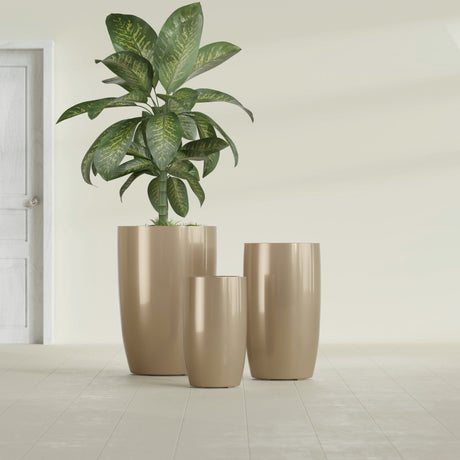 Lisbon Tall Round fiberglass planter in Gloss Metallic Gold, size range, in a sunlit interior