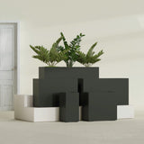 Potsdam Corner fiberglass planter in Matte Charcoal, size range, in a sunlit interior