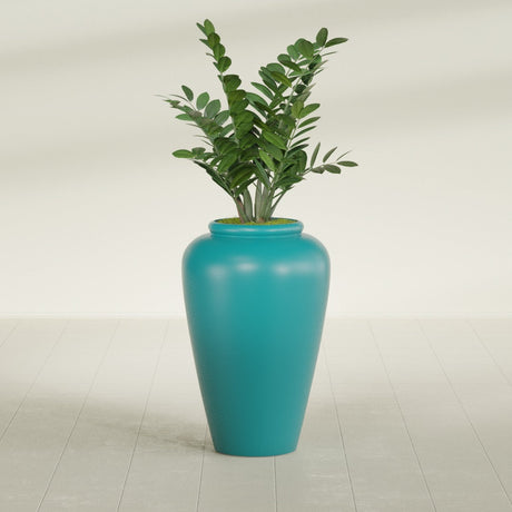 Barà Jar fiberglass planter in Satin Seafoam Green, shown planted, in a sunlit interior