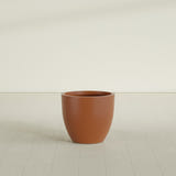 Wannsee Round Planter in Matte Terra Cotta, 27"D × 24"H, shown empty
