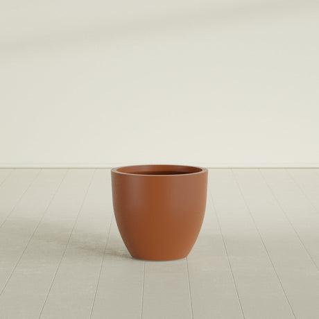 Wannsee Round Planter in Matte Terra Cotta, 27"D × 24"H, shown empty