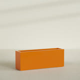 Miami Narrow Rectangular Planter in Gloss Tangerine, 48"L × 12"D × 18"H, shown empty