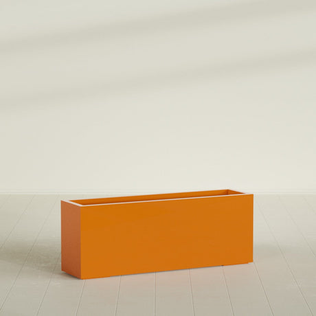 Miami Narrow Rectangular Planter in Gloss Tangerine, 48"L × 12"D × 18"H, shown empty