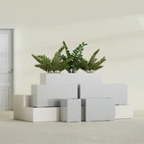 Tolga Rectangular fiberglass planter in Metallic Silver, size range, in a sunlit interior