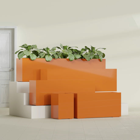 Miami Corner fiberglass planter in Gloss Tangerine, size range, in a sunlit interior