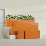 Miami Narrow Rectangular fiberglass planter in Gloss Tangerine, size range, in a sunlit interior