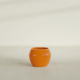 Shanghai Fishbowl Planter in Gloss Tangerine, 16", shown empty