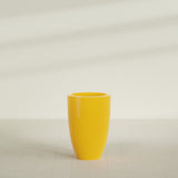 Brannan Tapered Round Planter in Gloss Saffron, 24"D × 35"H, shown empty
