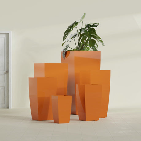 Toulan Tapered Square fiberglass planter in Gloss Tangerine, size range, in a sunlit interior