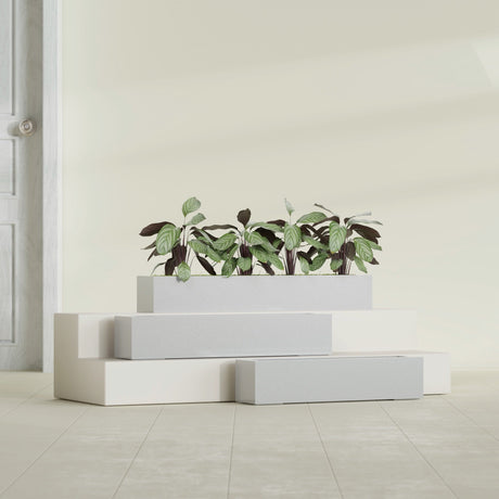 Salon Box fiberglass planter in Metallic Silver, size range, in a sunlit interior
