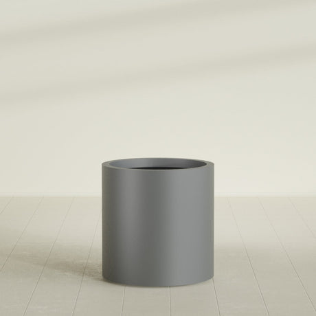 Rio Grande Cylinder Planter in Matte Gunmetal, 22"D × 22"H, shown empty