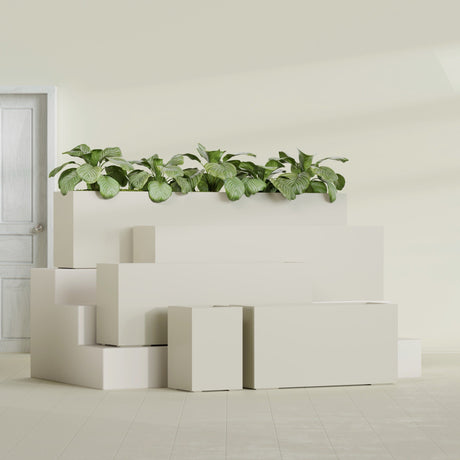 Miami Corner fiberglass planter in Satin Beige, size range, in a sunlit interior