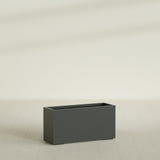 Tolga Rectangular Planter in Matte Charcoal, 48"L × 16"D × 24"H, shown empty