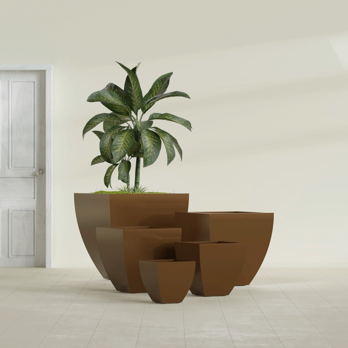 Lima Tapered Square fiberglass planter in Metallic Bronze, size range, in a sunlit interior