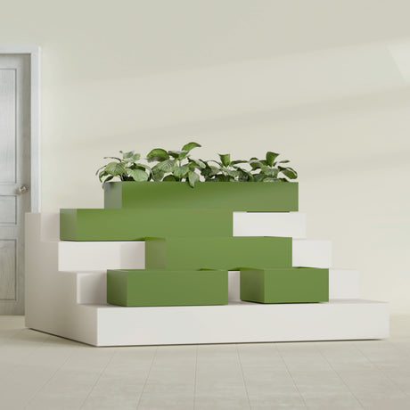 Antwerp Corner fiberglass planter in Satin Green, size range, in a sunlit interior