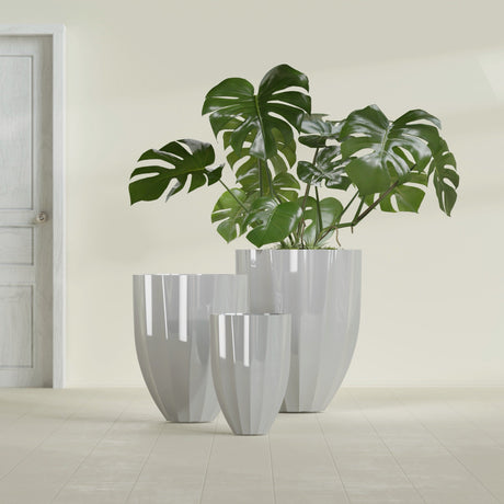 Alicante Fluted fiberglass planter in Metallic Silver, size range, in a sunlit interior