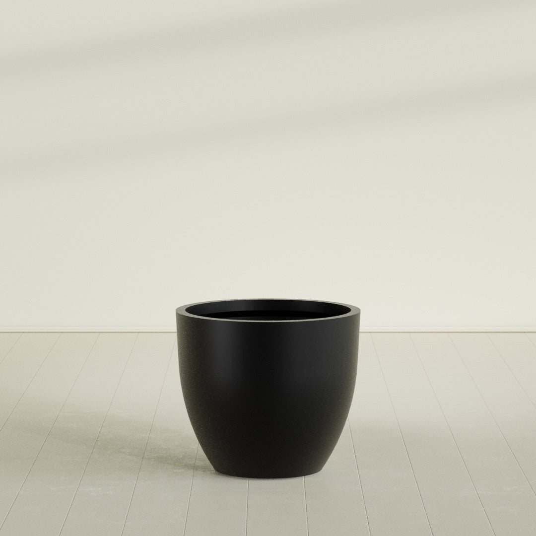 Wannsee Round Planter in Matte Black, 39"D × 34"H, shown empty