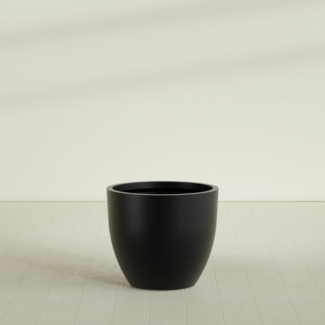 Wannsee Round Planter in Matte Black, 39"D × 34"H, shown empty