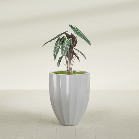 Alicante Fluted fiberglass planter in Metallic Silver, shown planted, in a sunlit interior