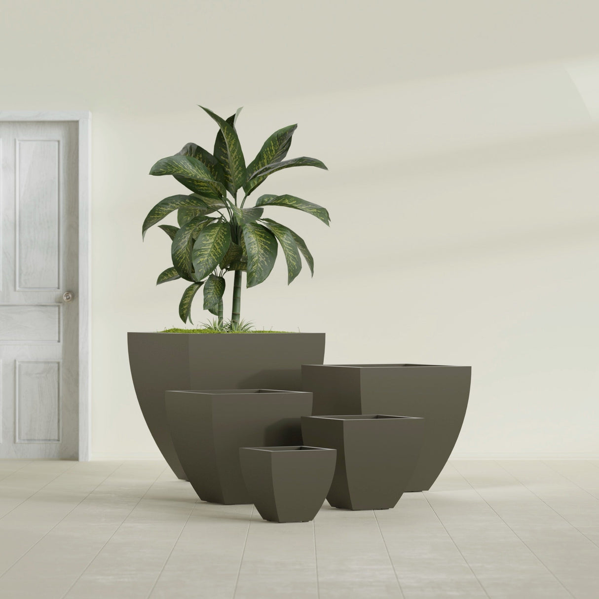 Lima Tapered Square fiberglass planter in Matte Bronze, size range, in a sunlit interior