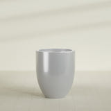 Valencia Tapered Round Planter in Metallic Silver, 27"D × 31"H, shown empty