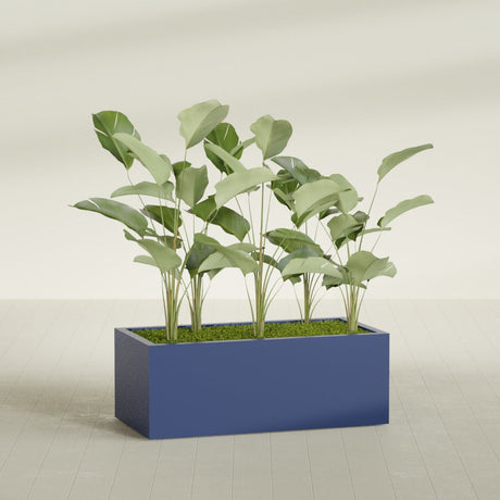 Torino Corner fiberglass planter in Matte Cobalt Blue, shown planted, in a sunlit interior