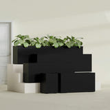 Miami Narrow Rectangular fiberglass planter in Matte Black, size range, in a sunlit interior