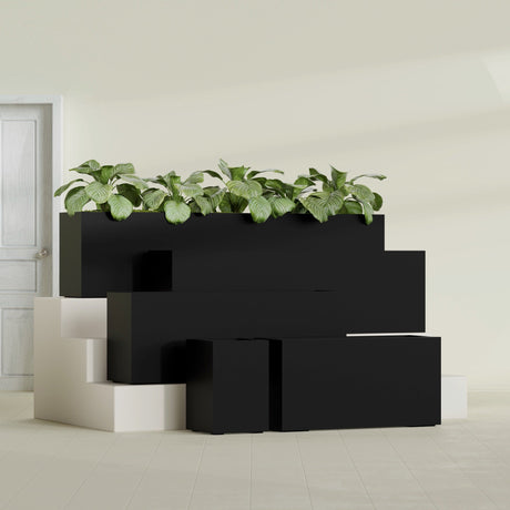 Miami Narrow Rectangular fiberglass planter in Matte Black, size range, in a sunlit interior