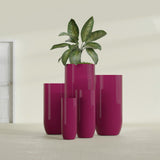 Saint Tropez Bullet Round fiberglass planter in Gloss Eggplant, size range, in a sunlit interior