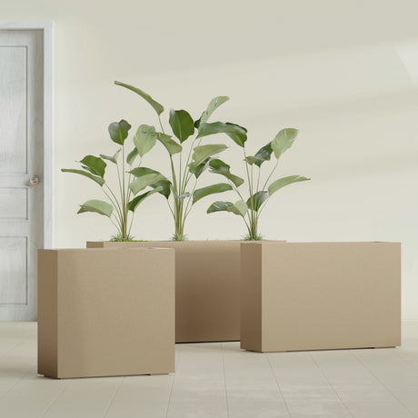 Milano Narrow Rectangular fiberglass planter in Gloss Metallic Gold, shown planted, in a sunlit interior