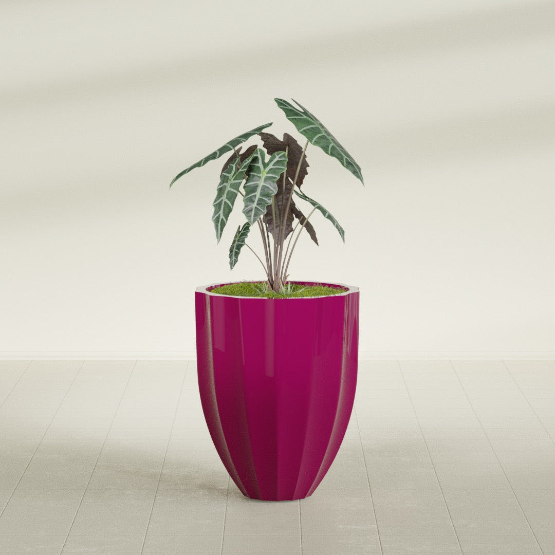 Alicante Fluted fiberglass planter in Gloss Eggplant, shown planted, in a sunlit interior