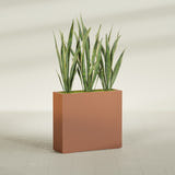 Delray Rectangular fiberglass planter in Matte Terra Cotta, shown planted, in a sunlit interior