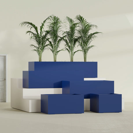 Torino Corner fiberglass planter in Matte Cobalt Blue, size range, in a sunlit interior