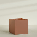 Montroy Cube Planter in Matte Terra Cotta, 60", shown empty