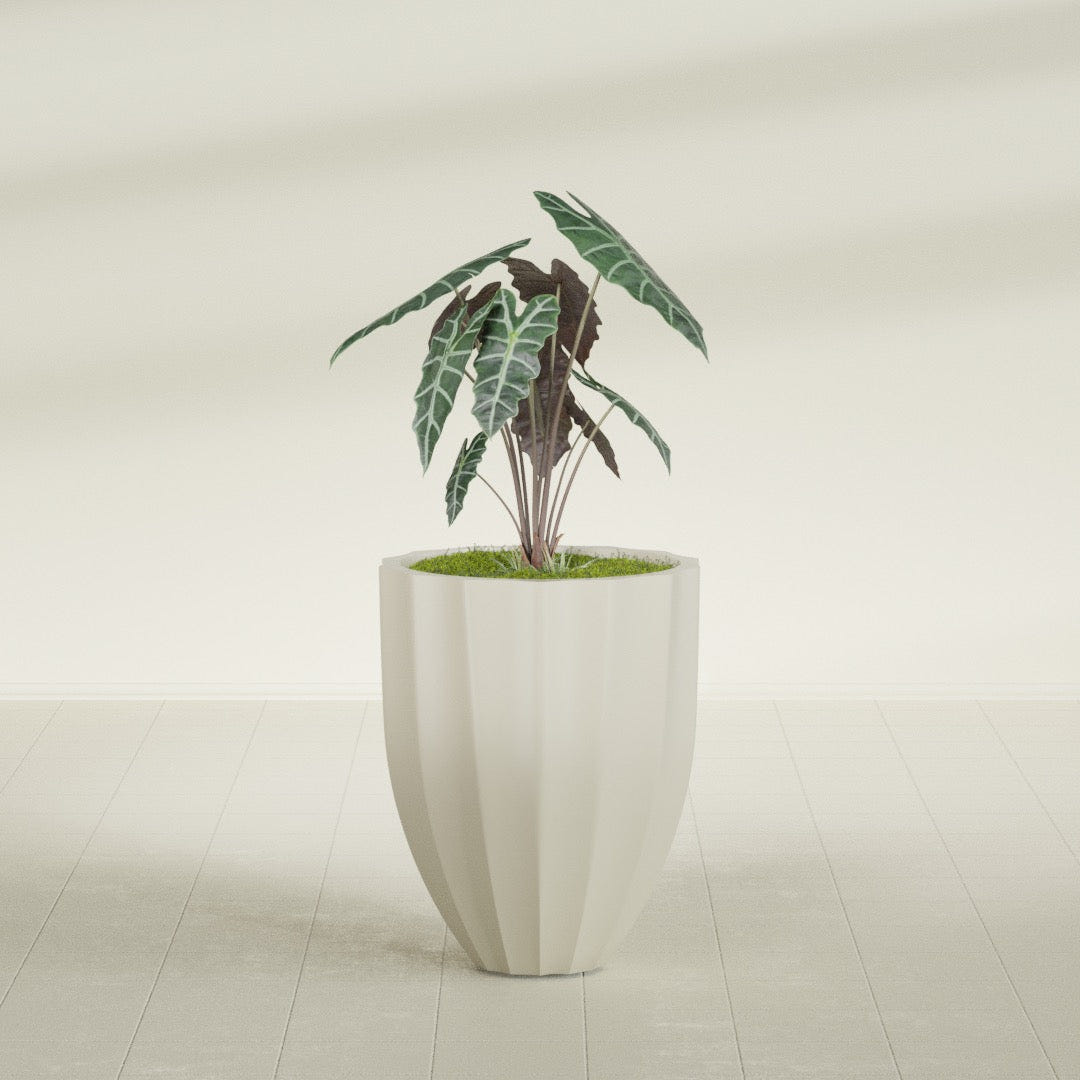 Alicante Fluted fiberglass planter in Satin Beige, shown planted, in a sunlit interior