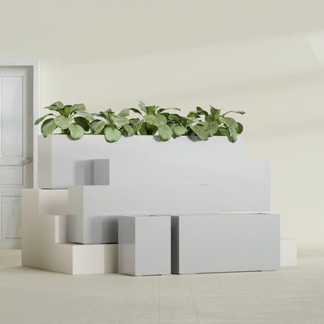 Miami Corner fiberglass planter in Metallic Silver, size range, in a sunlit interior
