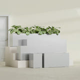 Miami Narrow Rectangular fiberglass planter in Metallic Silver, size range, in a sunlit interior