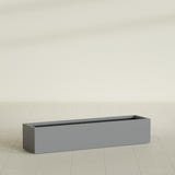Cuba Low Rectangular Planter in Matte Gunmetal, 60"L × 14"D × 12"H, shown empty