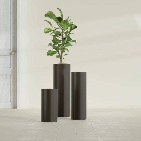 Corry Cylinder fiberglass planter in Matte Dark Brown, size range, in a sunlit interior