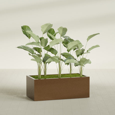 Torino Wide Rectangular fiberglass planter in Metallic Bronze, shown planted, in a sunlit interior