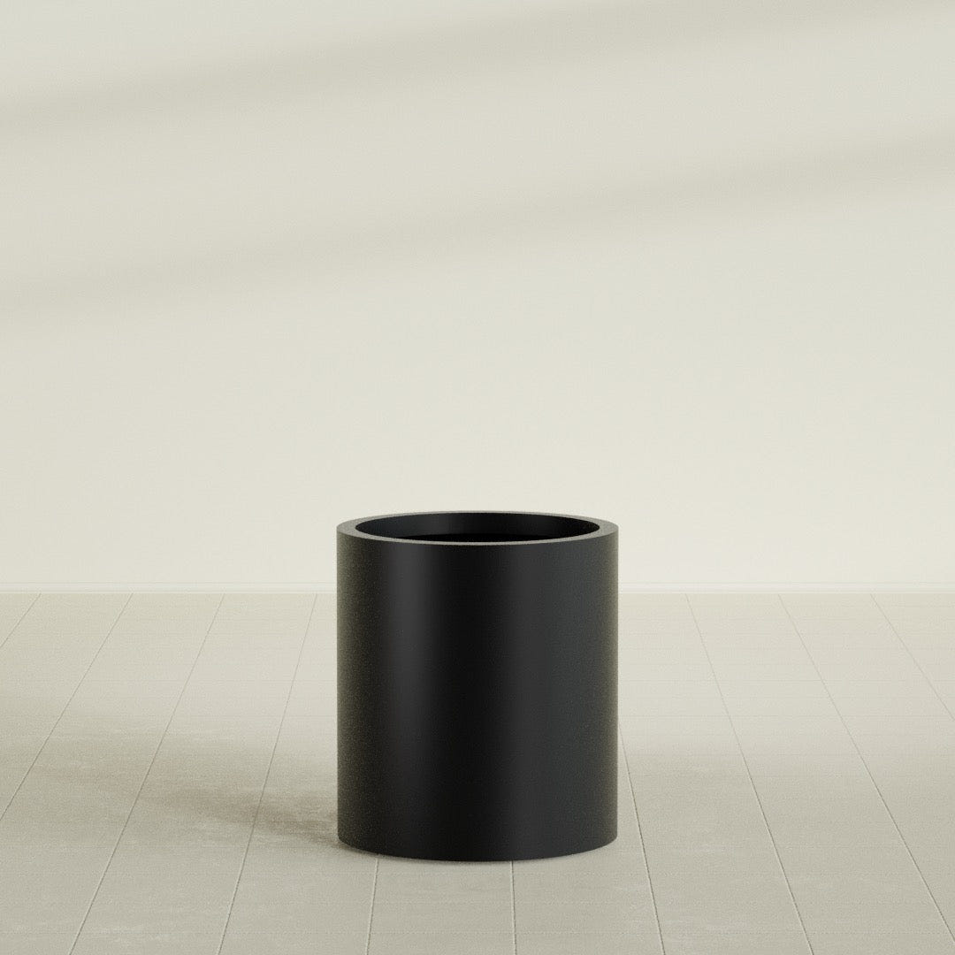 Rio Grande Cylinder Planter in Matte Black, 18"D × 20"H, shown empty