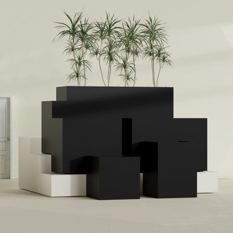 Brisbane Corner fiberglass planter in Matte Black, size range, in a sunlit interior