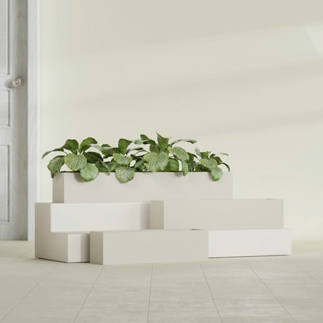 Monaco Rectangle fiberglass planter in Satin Beige, shown planted, in a sunlit interior